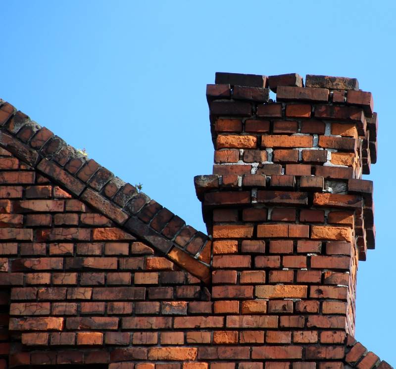 Signs Your Chicago Heights Home Needs a Chimney Inspection Damaged chimney on an Chicago Heights home showing cracks and missing mortar